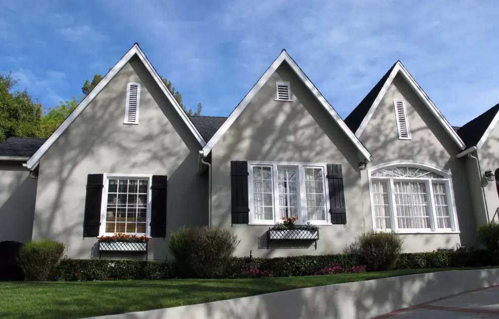 House with flowerboxes below the windows.