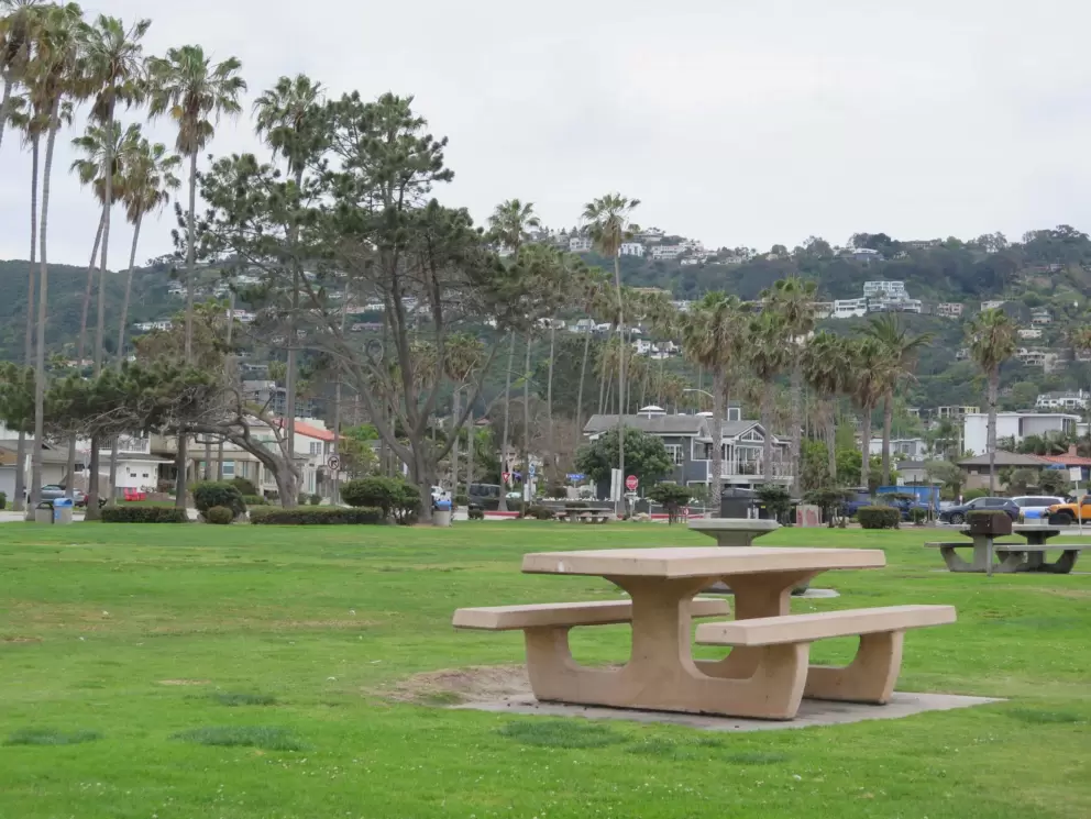 Picnic table with hills behind. 