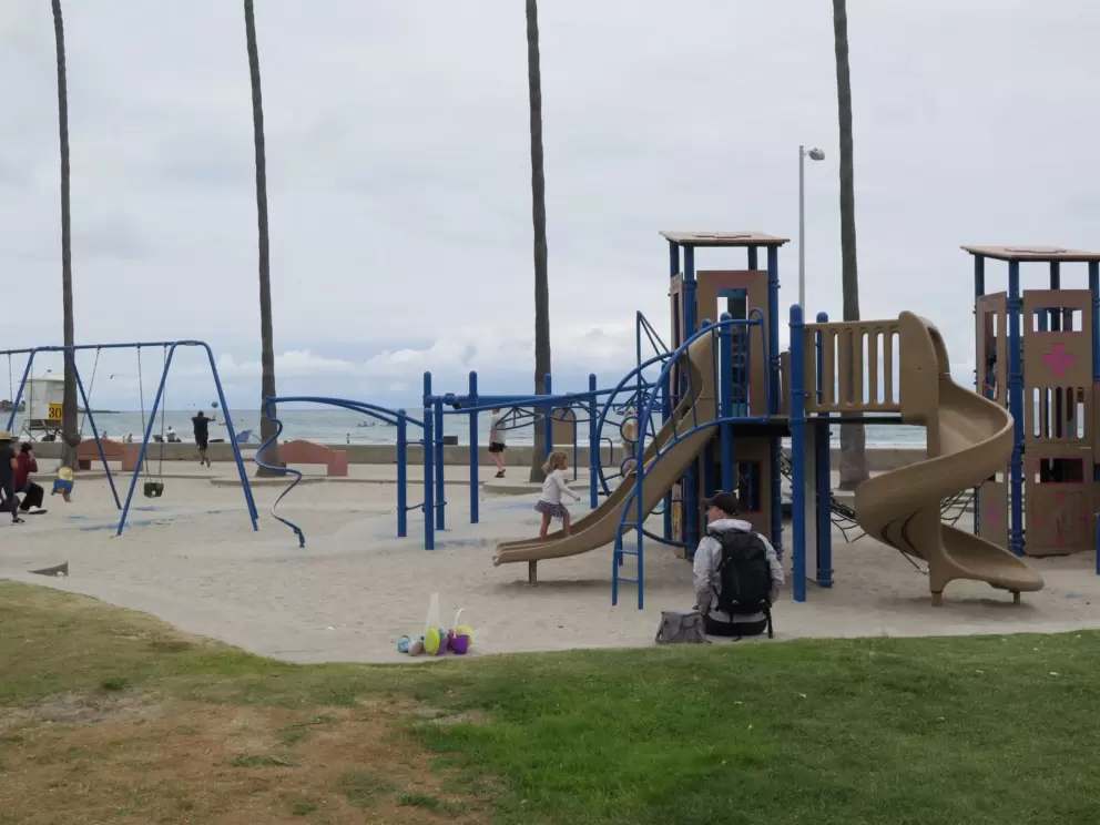 Swings, spinner, monkey bars, and play structure. 