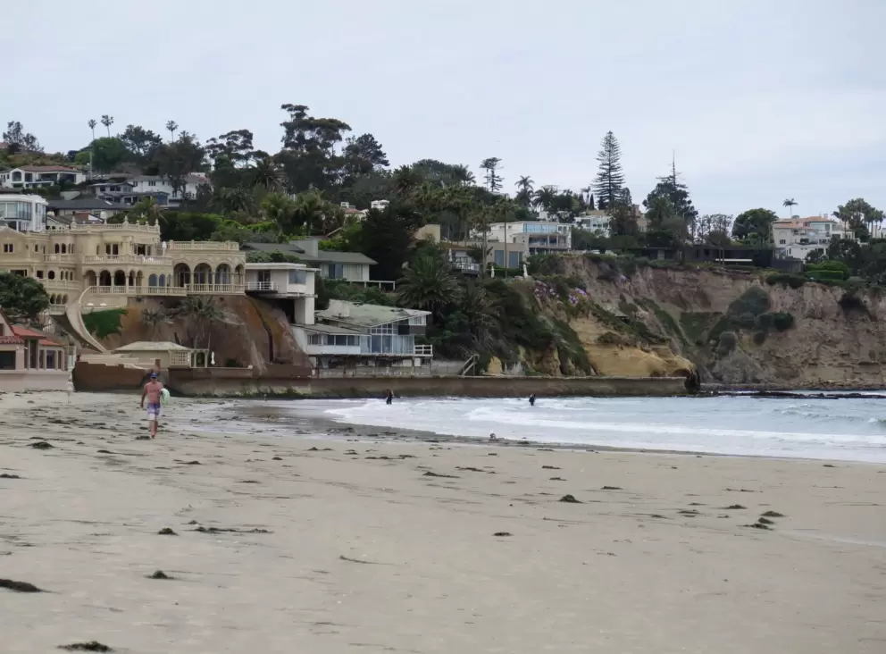 The beach that is next to the playground. 