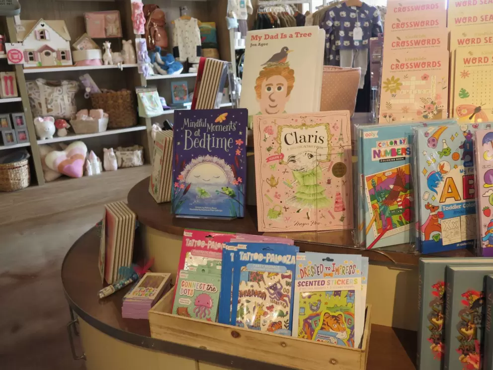 Children's books for sale inside Parisien Gourmandises. 