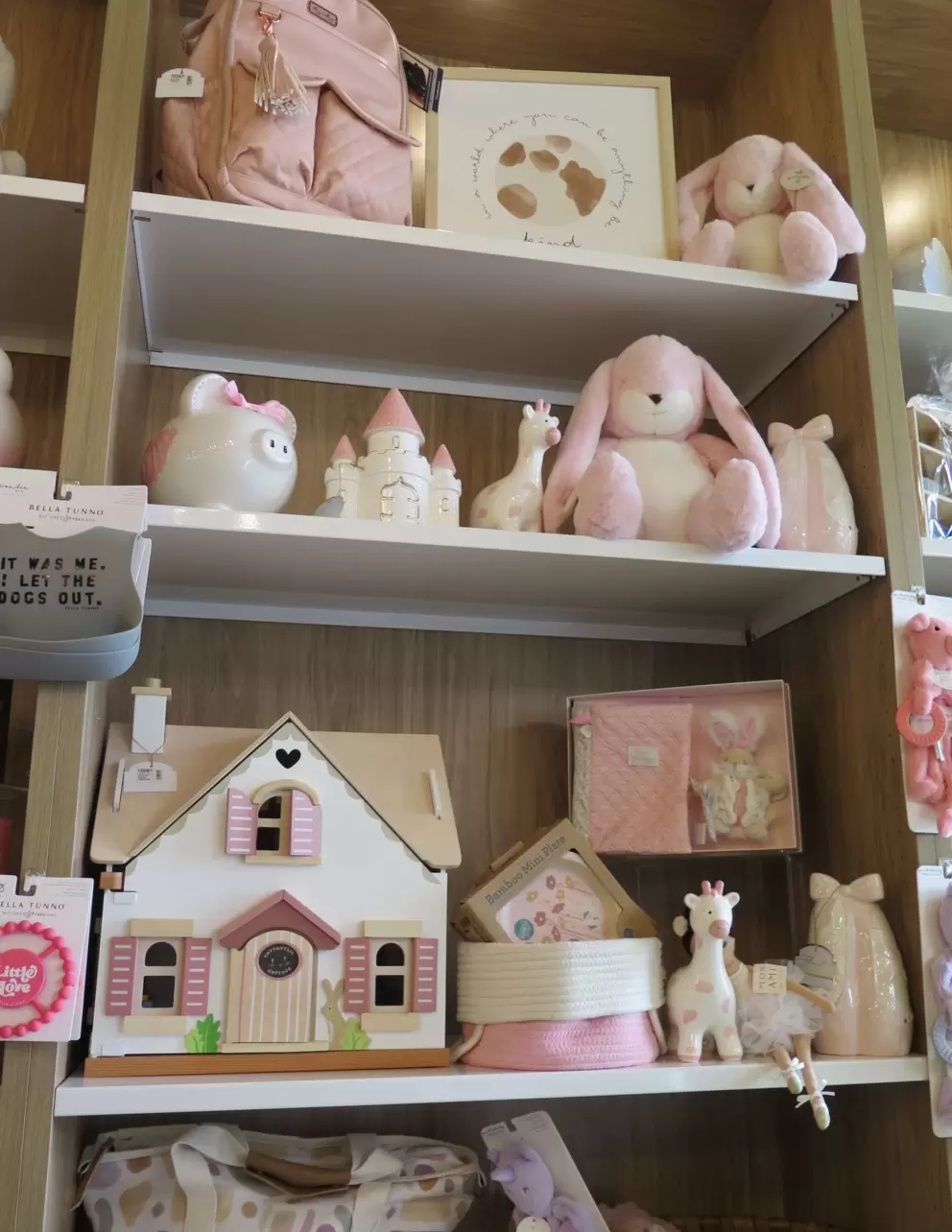 Dollhouses and stuffies for sale inside Parisien Gourmandises. 