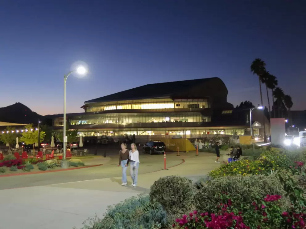 Walking around campus at night, with palms and mountains silhouetted against the sky. 