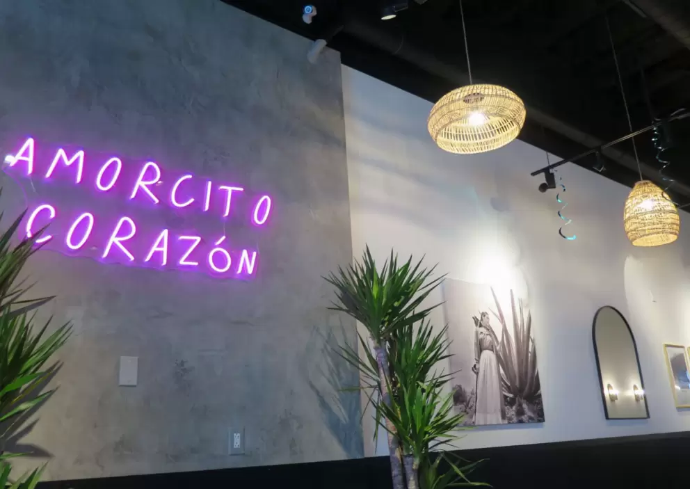 Wicker lanterns and neon "Amorcito corazon" inside Lupe's Mexican Eatery. 