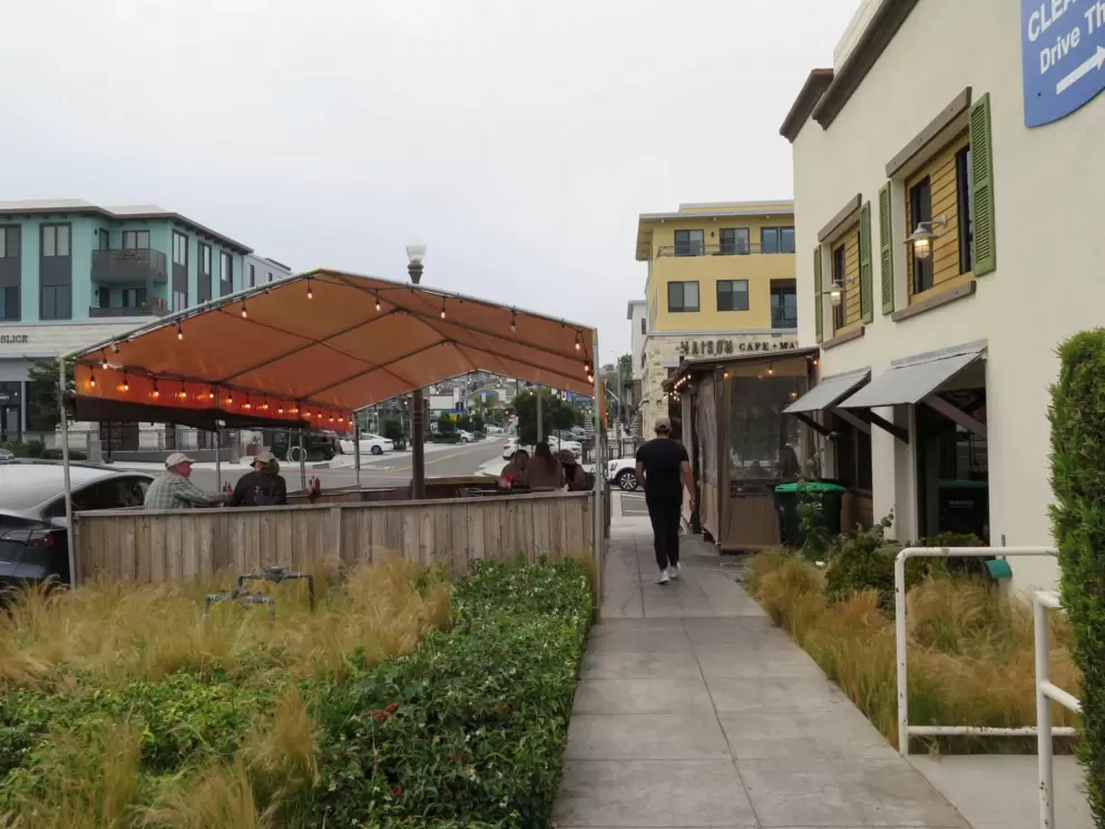 The Shwack Beach Grill has outdoor seating with strung lights. 