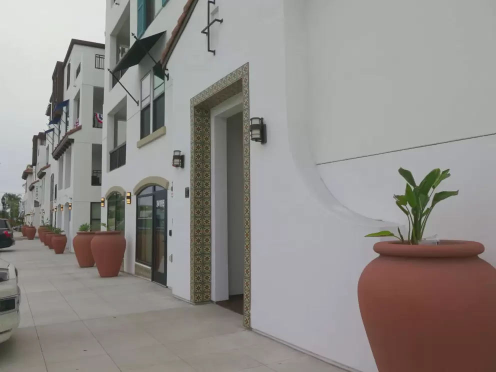 Spanish tile doorway and large ceramic pots. 