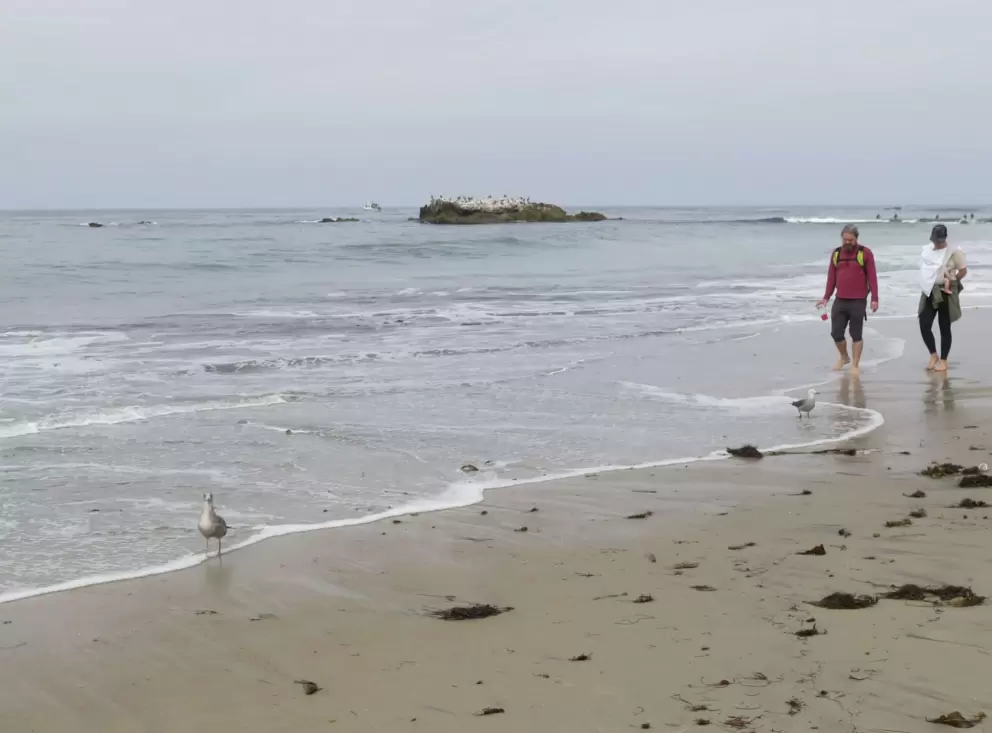 Strolling along Main Beach on a July day. 