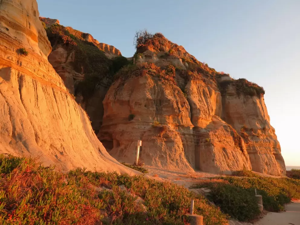Cliffs glowing with the red light of sunset. 
