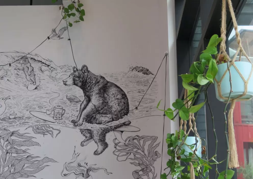Bear on a surfboard mural. 