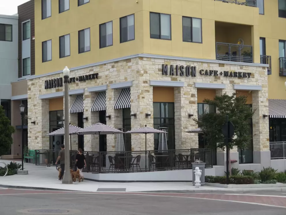Maison Cafe and Market has a pretty, yellow exterior. 
