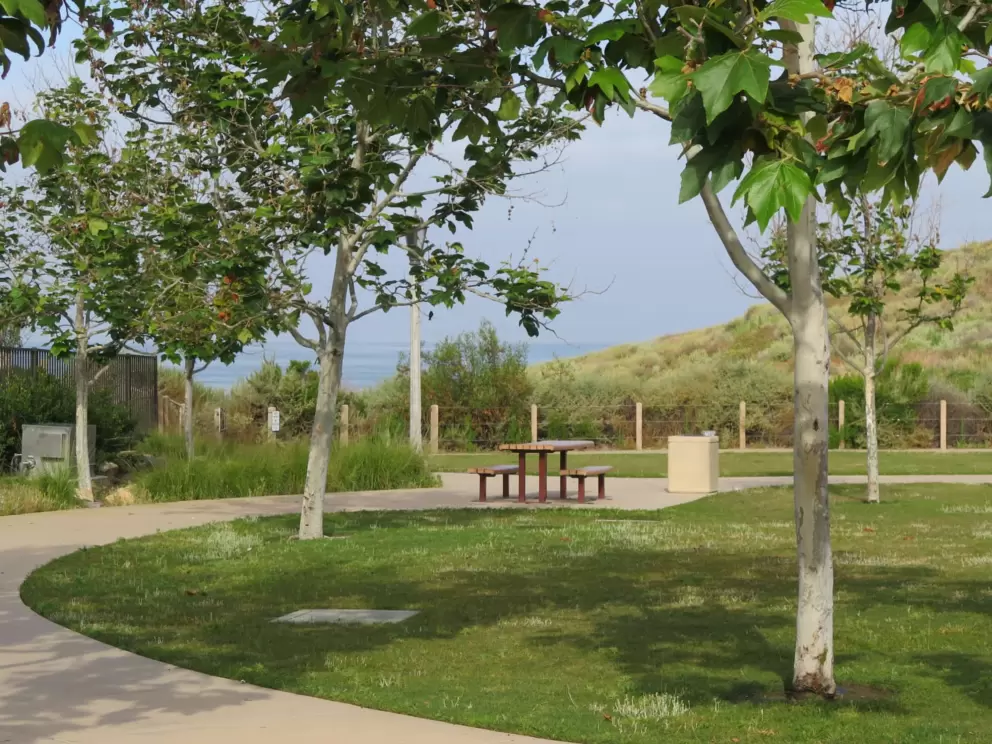 Picnic table and sea beyond. 