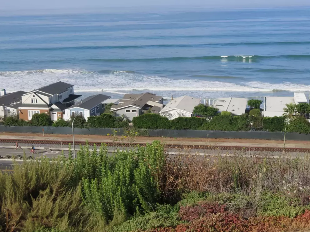 Beach houses and waves breaking. 
