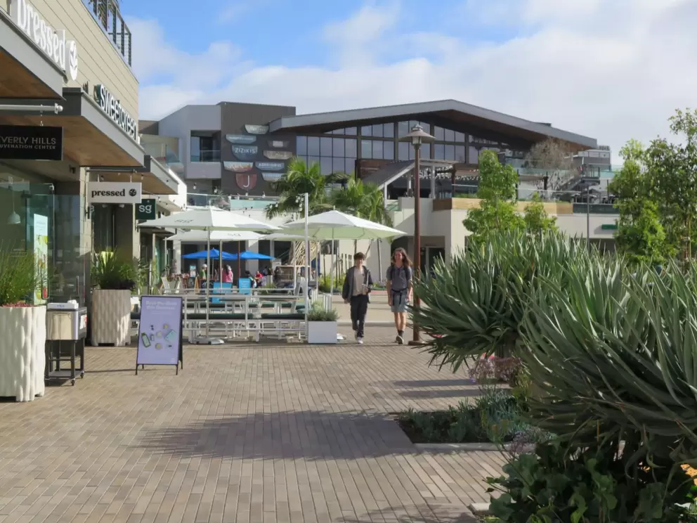 Strolling around the outdoor mall on a sunny day. 