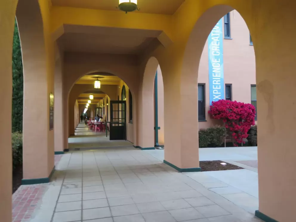 Walkway with arches and bougainvillea.