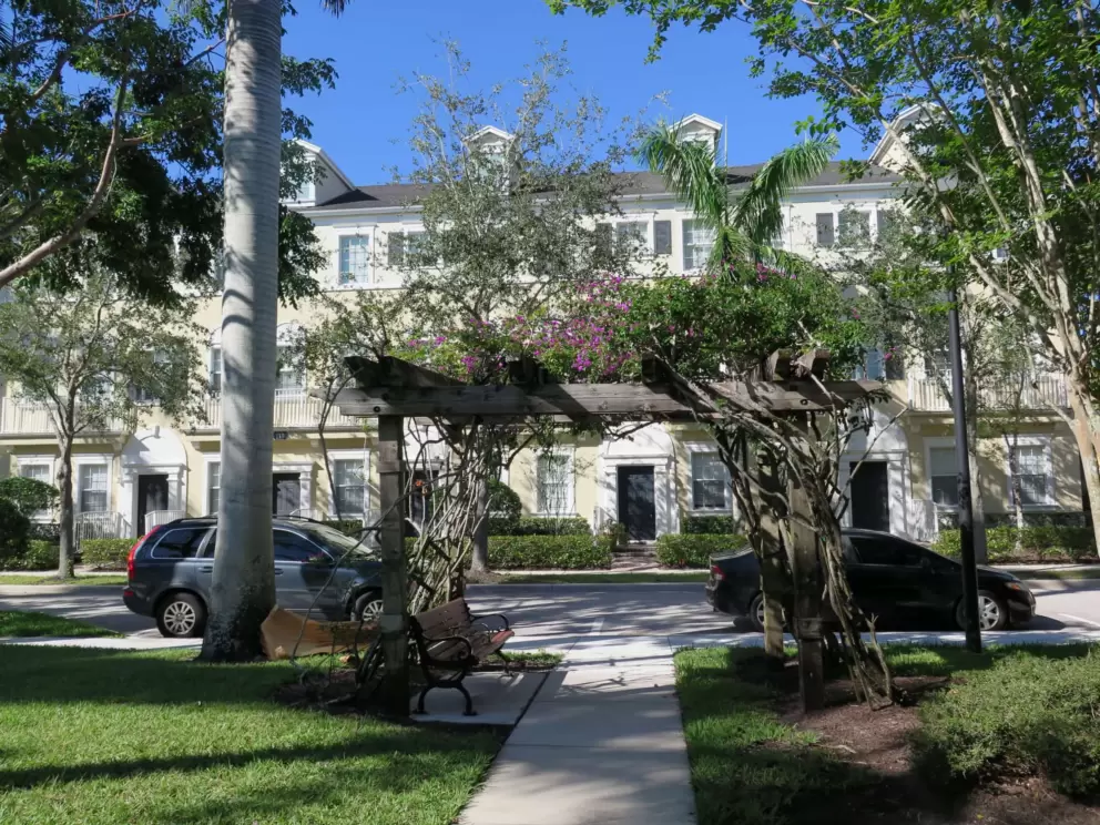 Townhouses with dormers, and pagoda with bougainvillea, in the Botanica neighborhood. 