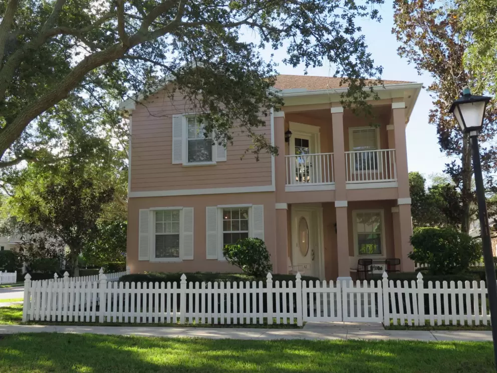 Pink house with oval window on the front door, in the Cambridge neighborhood. 
