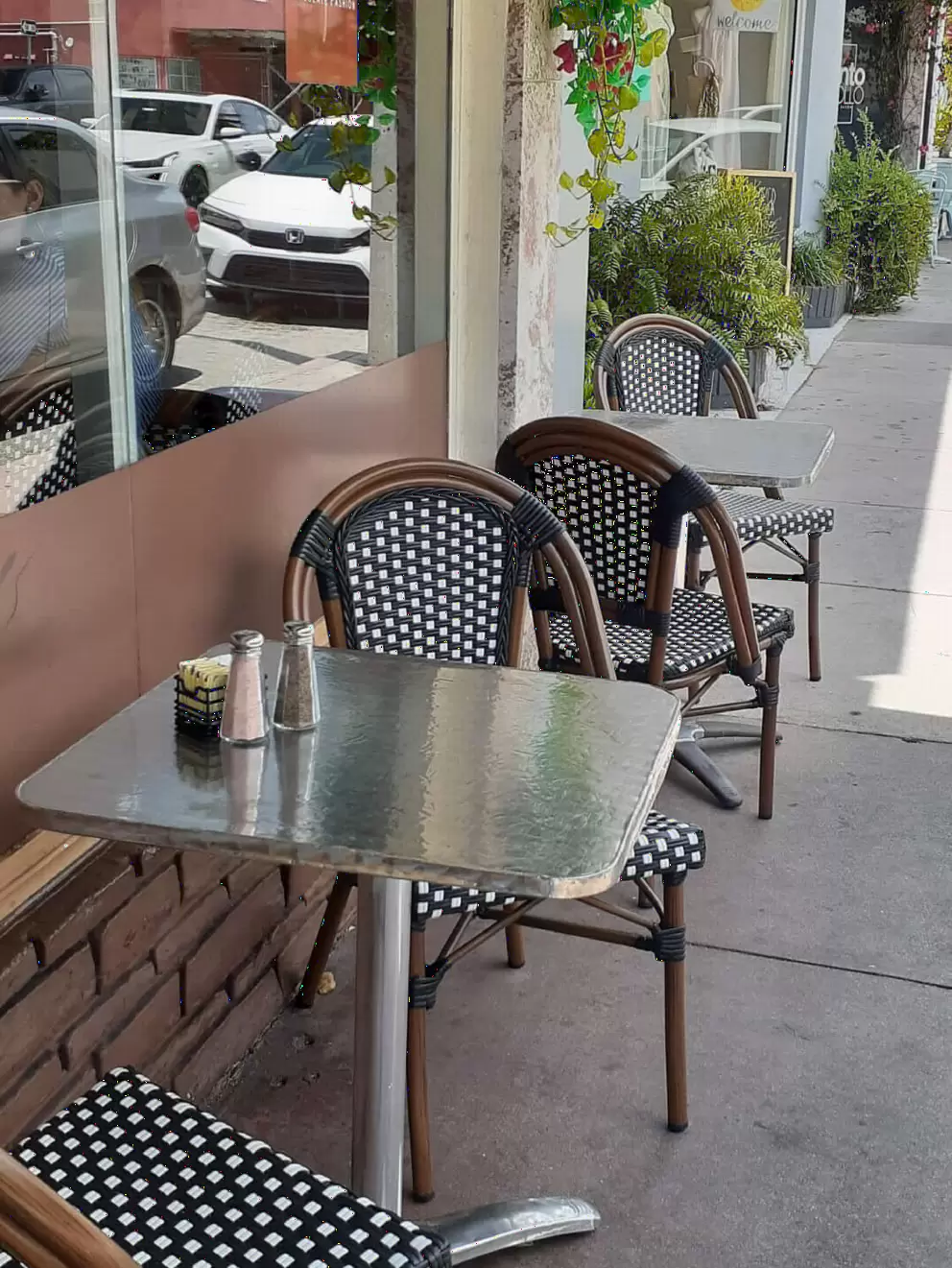 Bistro seating outside Chocolate Fashion Cafe. 
