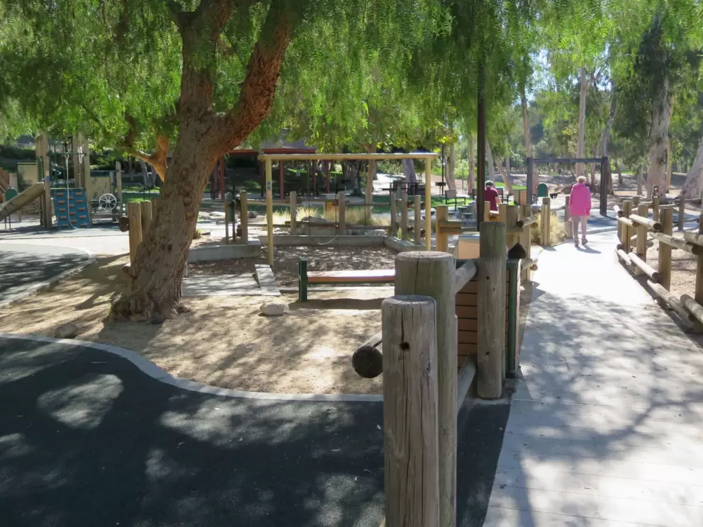 The playground, at the far end of the path. 