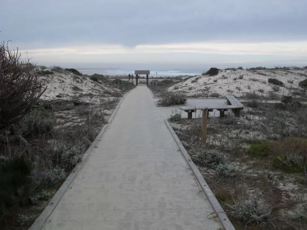 Squared archway to the beach- you have arrived!