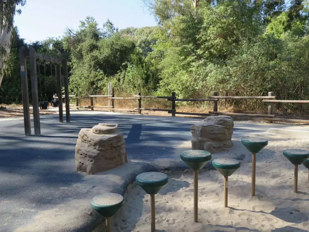 Stepping stones and baby swings at the playground. 