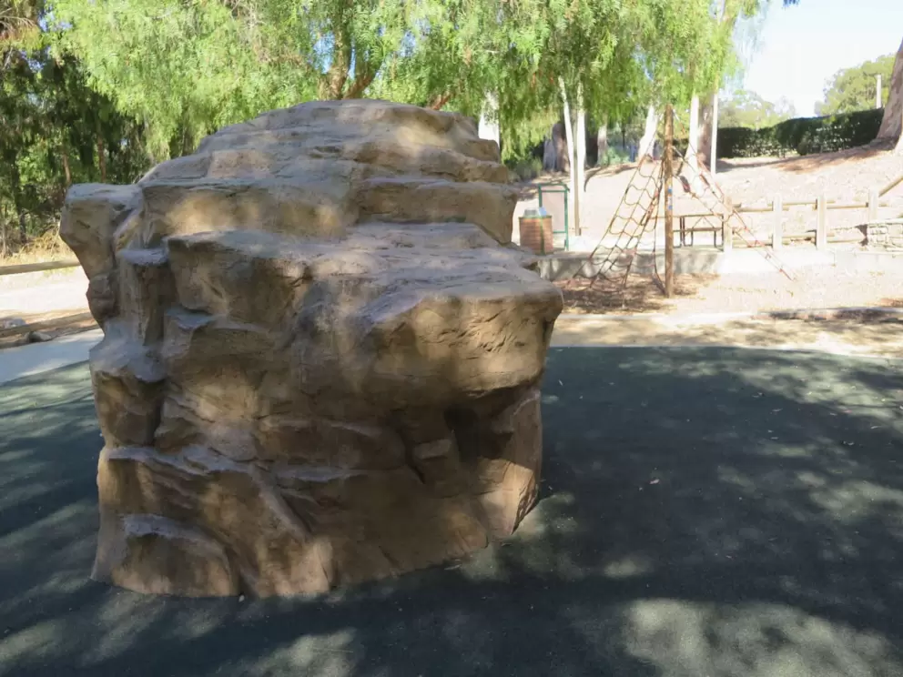 Climbing rock at the playground. 