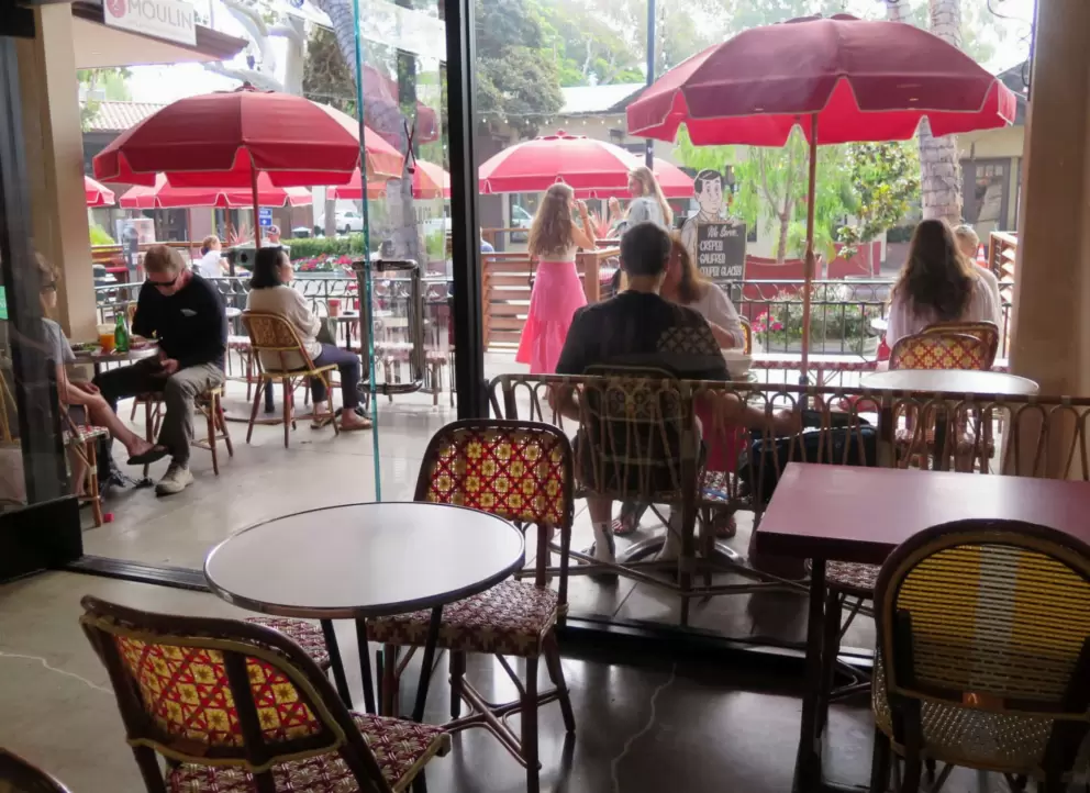 Guests enjoy the outdoor seating on a Monday morning in August. 