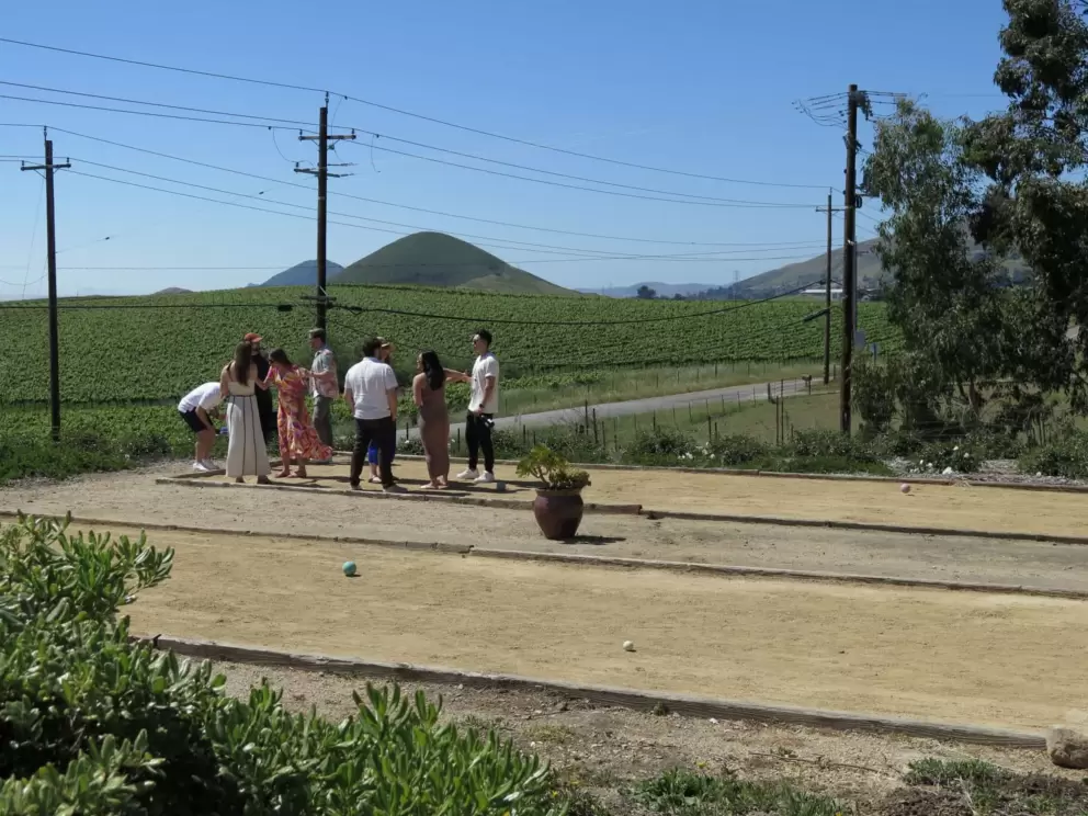 Chatting with friends at the jeu de boules court. 