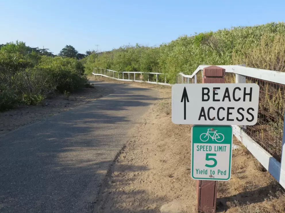 Beach Access sign. There is no beach access from the path because the dunes are blocked off. The only beach access is from Azure Street and Atascadero Rd. 