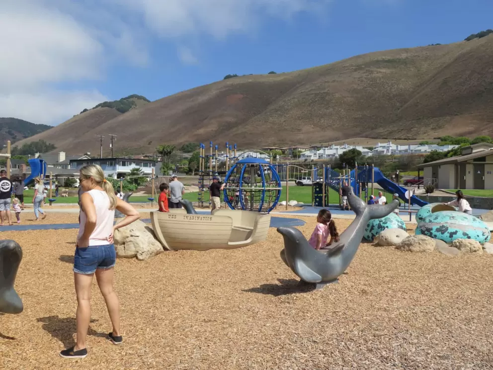 Boat and dolphin sculpture to climb, plus dinosaur eggs on the right. 