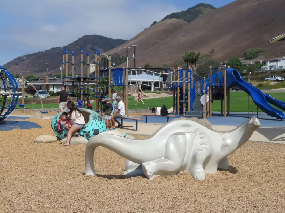 Dinosaur sculpture and dinosaur egg behind. 