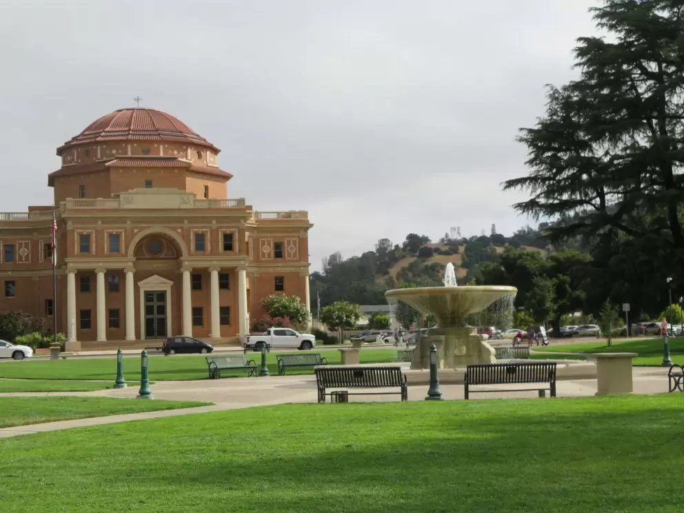 Fountain with benches around it. 