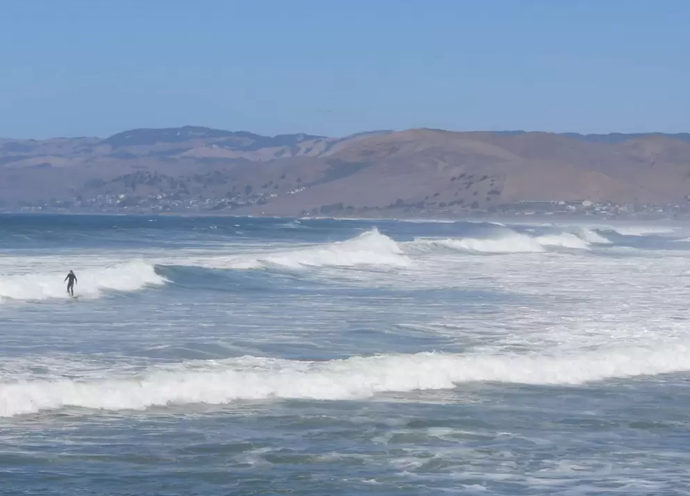 A surfer braves the cold. 