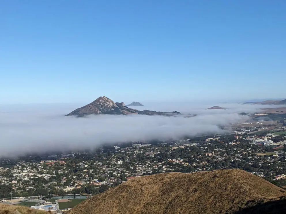 The mountains are islands in the fog. 