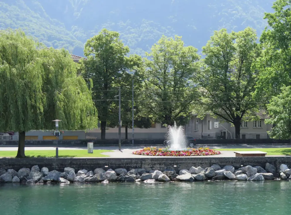 The walking path along the emerald-green water, as seen from the ferry. 