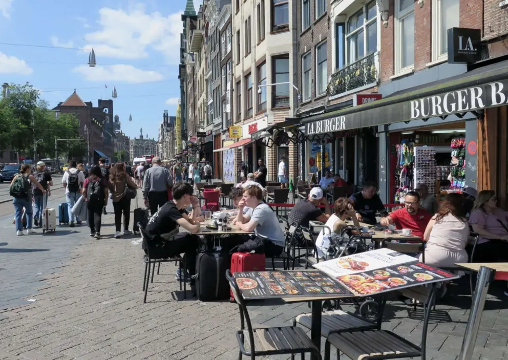 Damrak, the street that leads out of the train station, is not very nice. 