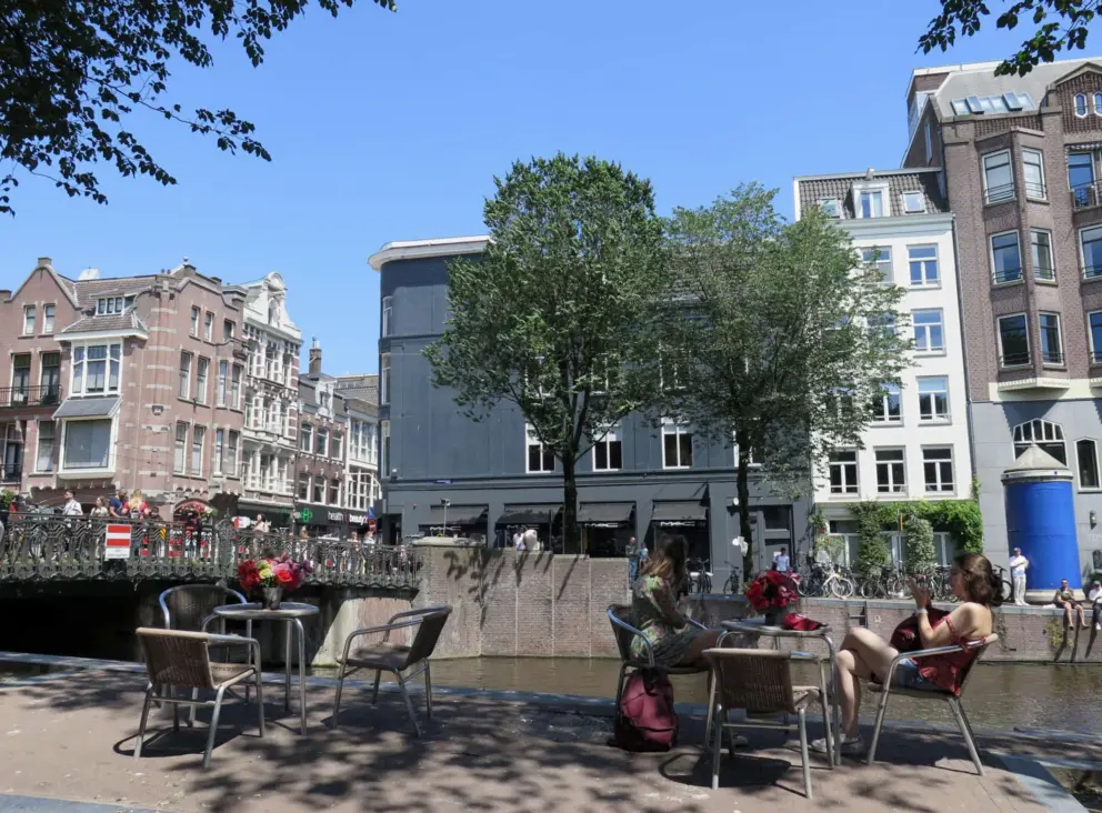 Sitting in the sun by a canal. 