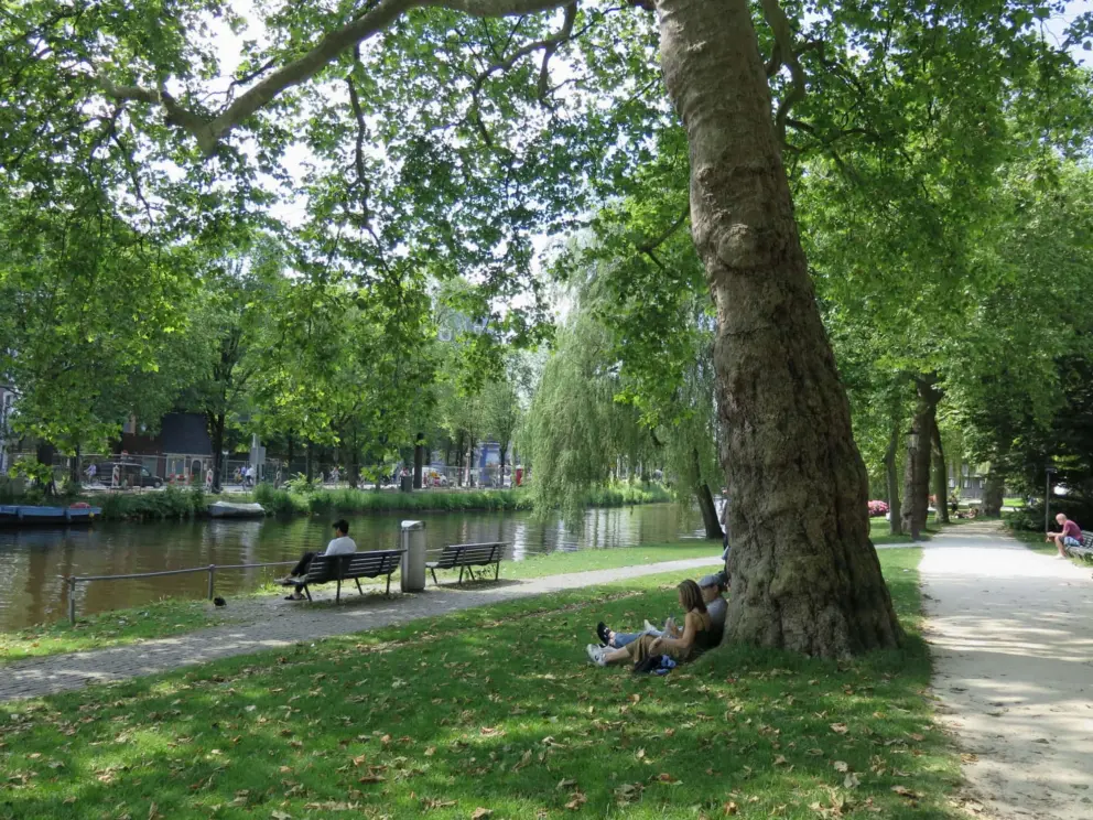 Sitting by the water at Weteringsplantsoen.
