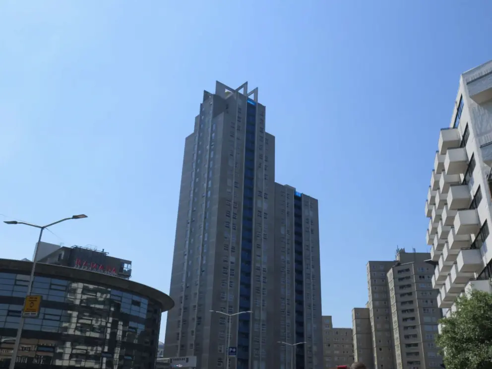 A modern highrise building in the town. 