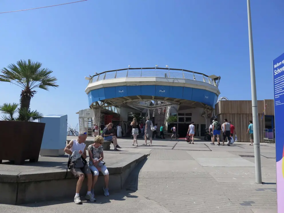 At the base of the pier. 