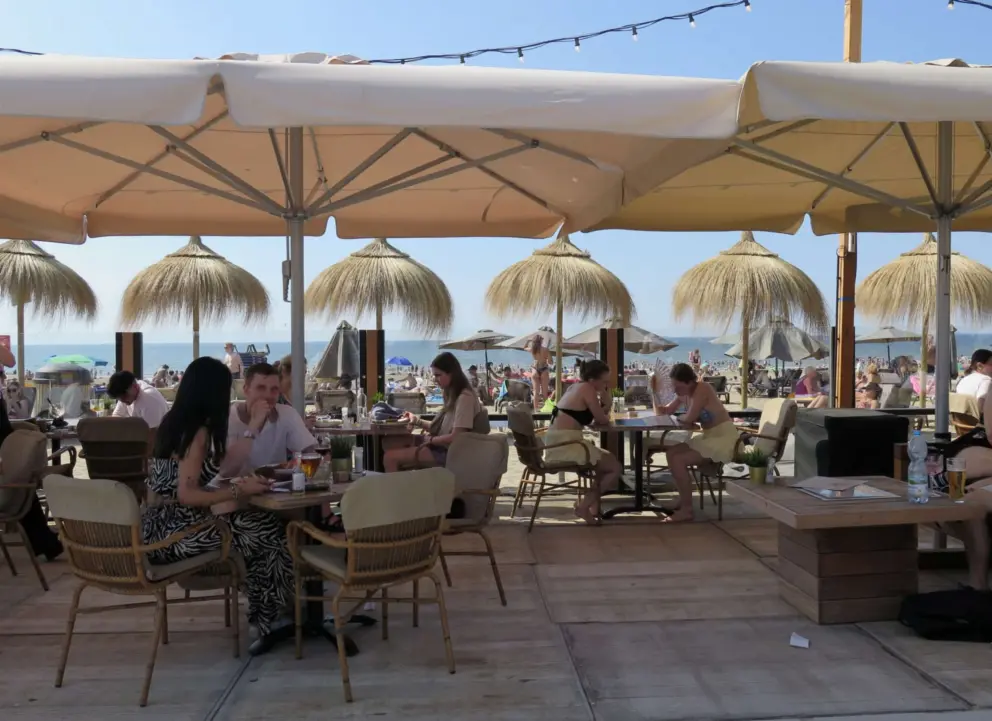 Summer cafes with grass umbrellas to add atmosphere. 