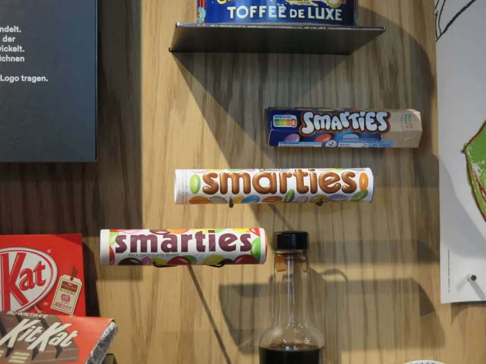 Smarties packaging across time. 