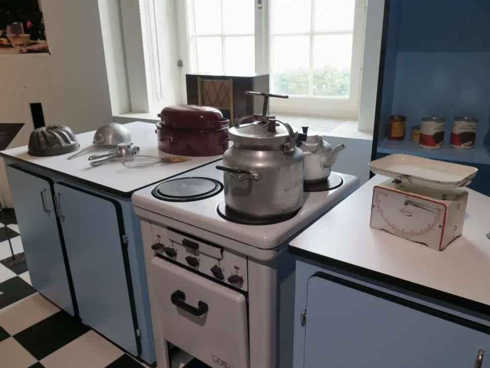 Old-fashioned kitchen with checkered floor. 