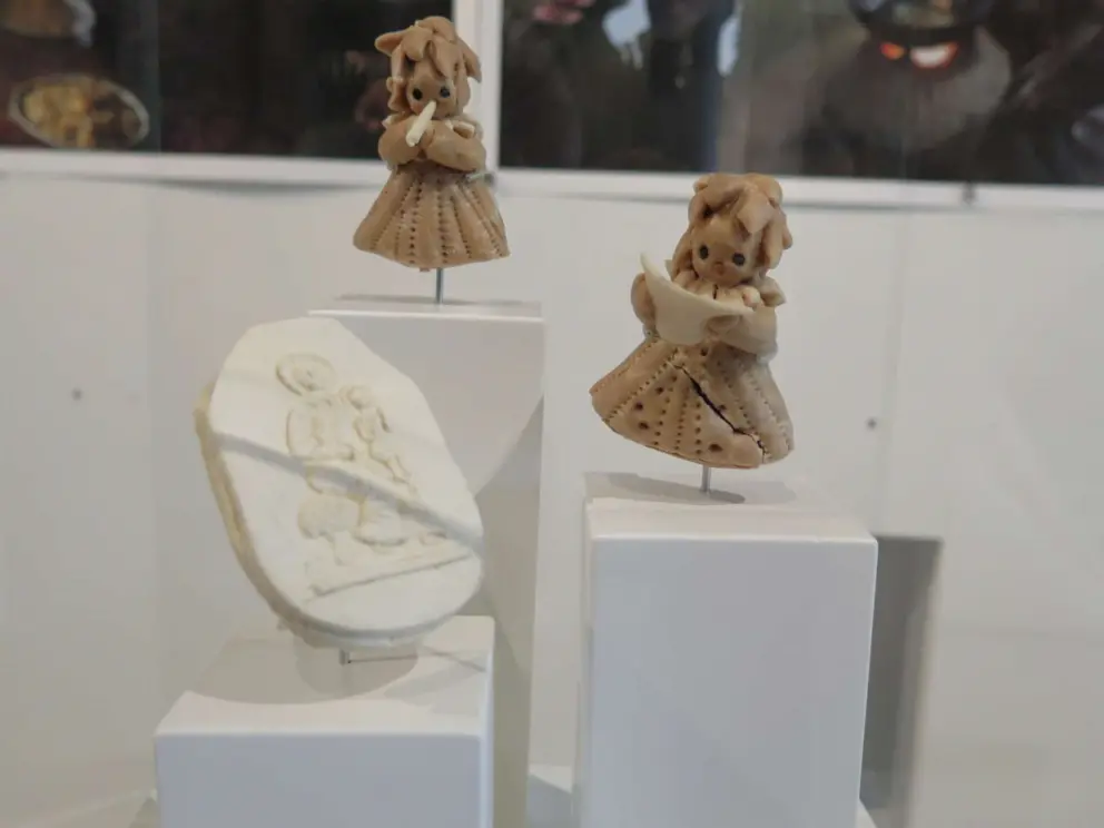 Bread shaped like angels, and Christmas tree decoration.