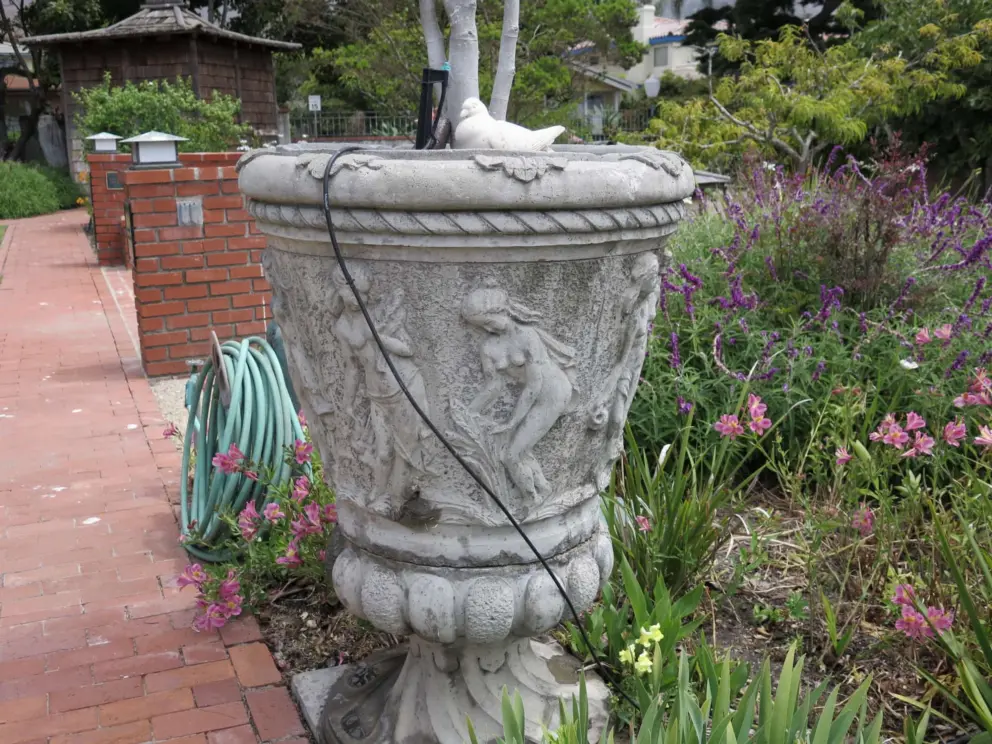 The garden is a bit rundown. A garden club needs to adopt it!