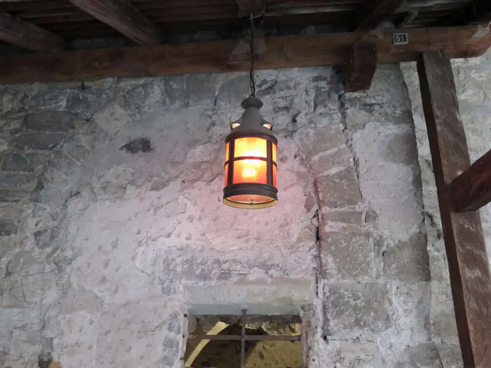 Lantern and stone wall. 