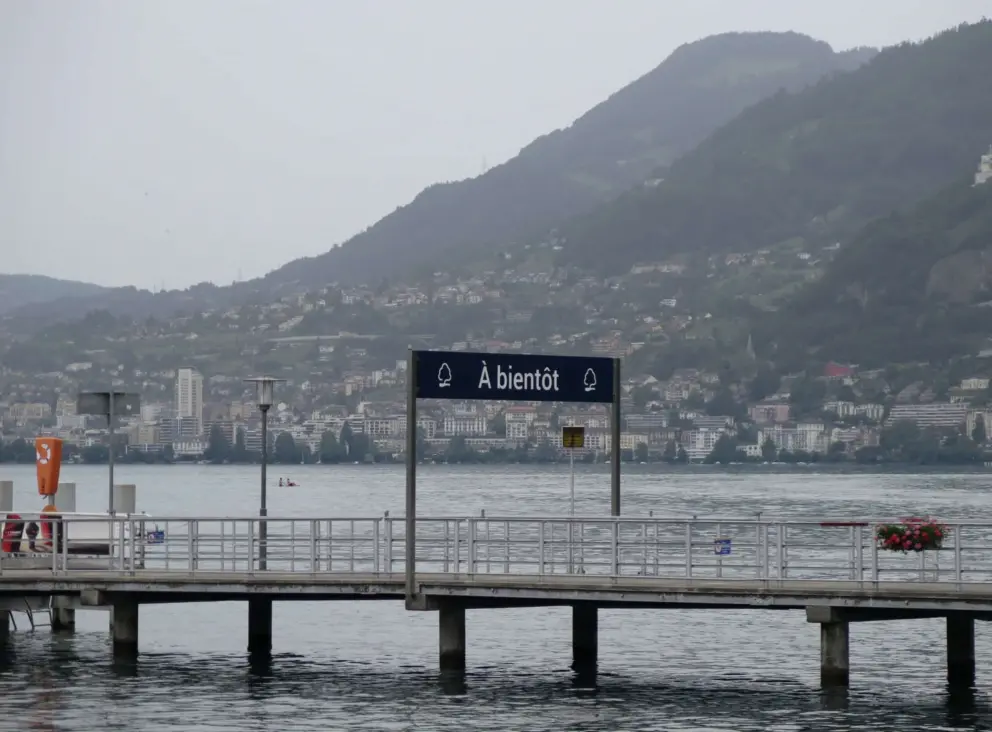 The ferry dock and mountains high above. 