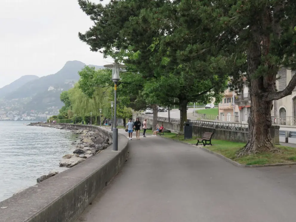 A family strolls along the waterfront. 
