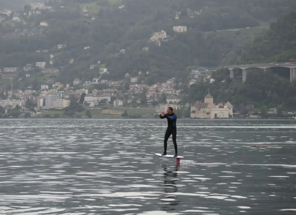 Foil surfer with Chillon Castle behind. 