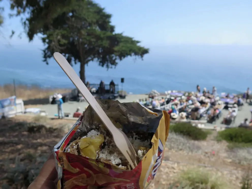 Eating carnitas and grilled pineapple over Frito Lays! A yummy treat at the lighthouse summer concert. 