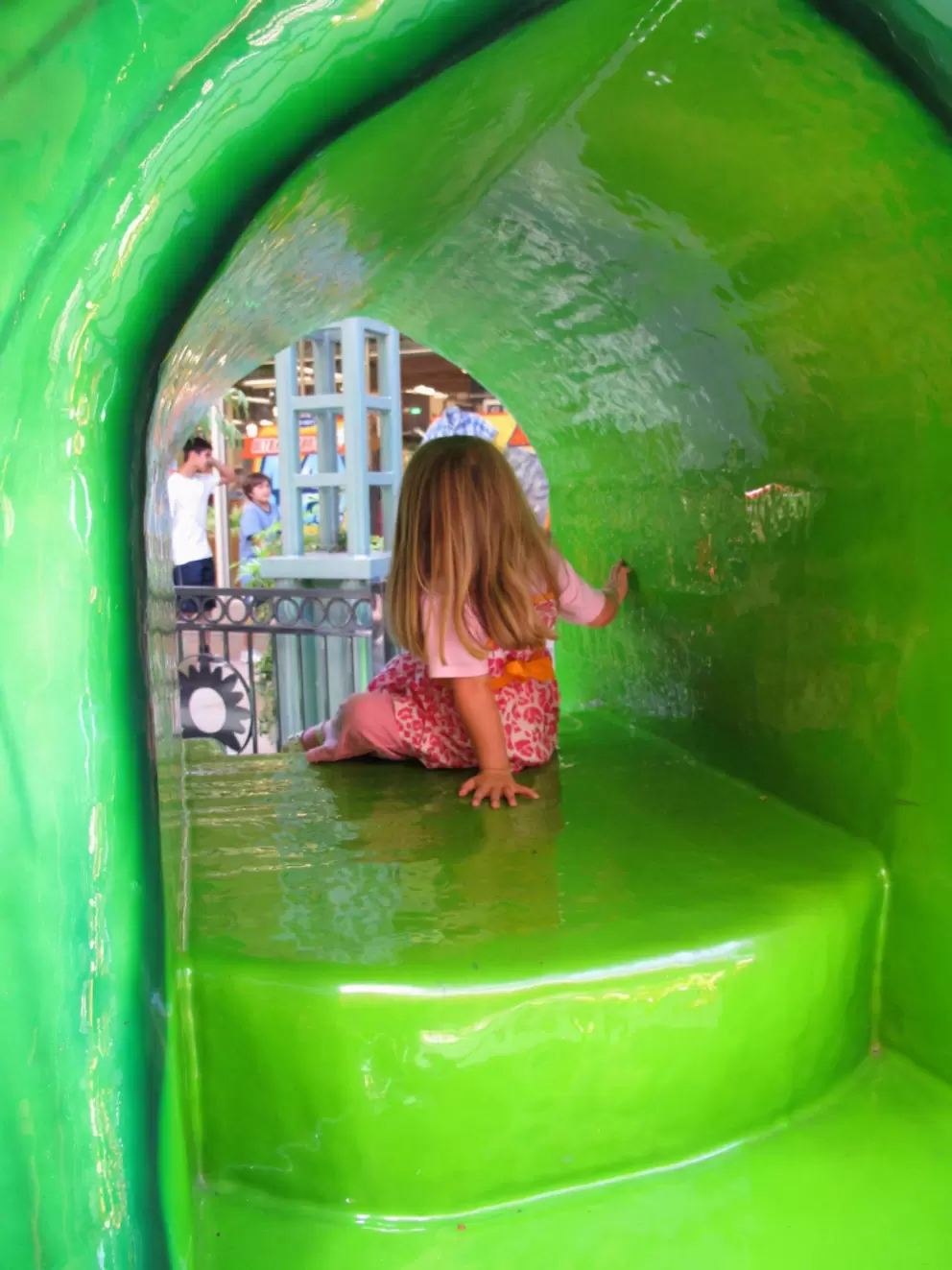 Slide inside a flower at the play area.